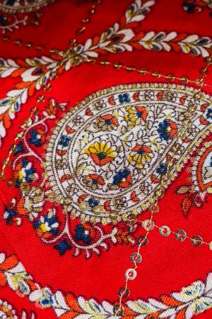 Beautiful rayon with paisley and floral print on bright red base, highlighted with sequins work. Soft, flowy and comfortable – perfect for kurti, dress, tops and festive wear (unstitched material).