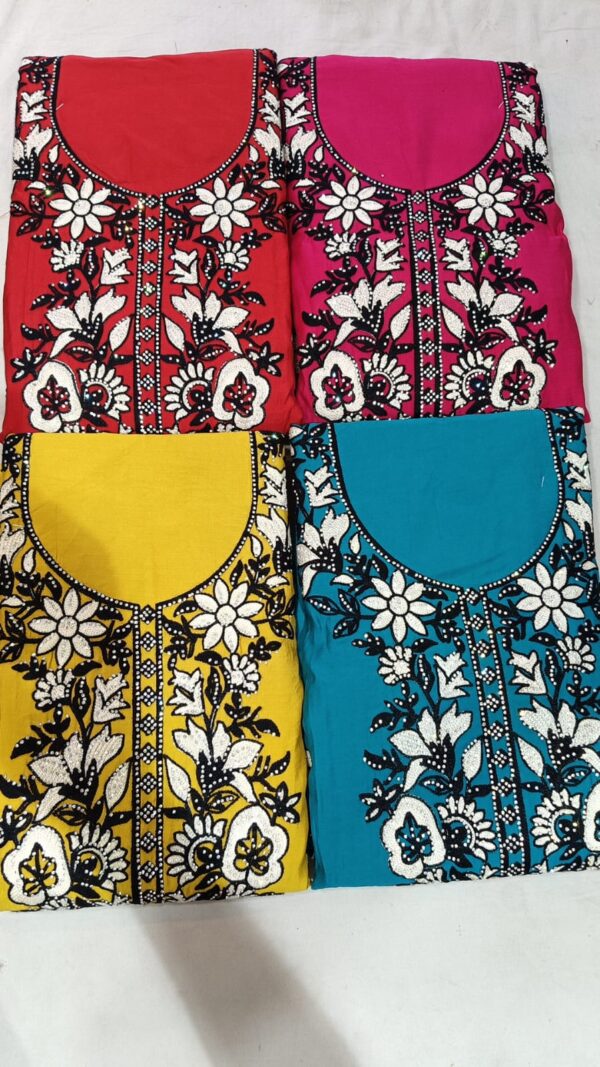 Elegant Roman Silk with intricate floral embroidery in white and black on a bright yellow base. Comes with three pieces – suit, pant and dupatta. The fabric is soft, breathable and flowy, making it ideal for festive wear, parties and special occasions. (unstitched material). - Image 2