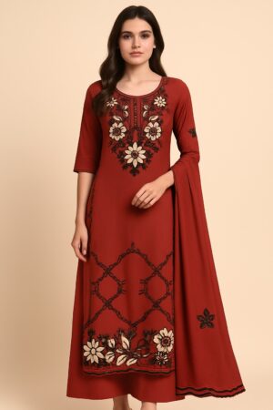 Elegant Roman Silk with intricate floral embroidery in shades of cream and black on a rich rust-red base. Comes with three pieces – suit, pant and dupatta. The fabric is soft, luxurious and has a graceful fall – perfect for party wear, festive occasions and special gatherings(unstitched material).