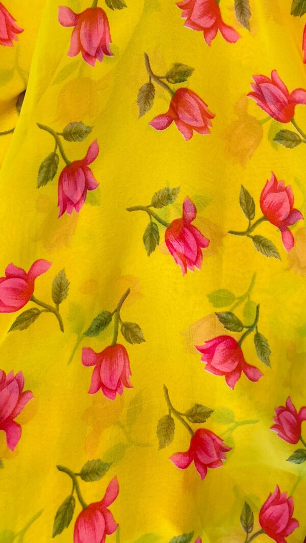 Chiffon yellow saree adorned with vibrant pink floral prints and a matching pink border, paired with a contrasting pink blouse piece - Image 2